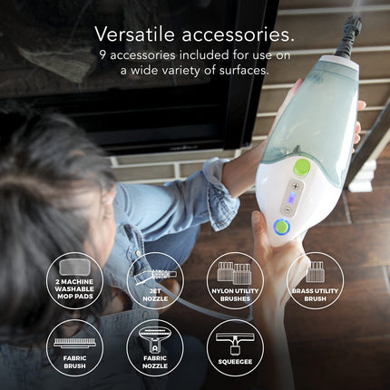 Person using a handheld cleaning device with various accessories displayed on screen.