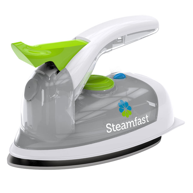 Steam iron with green handle and Steamfast logo on a white background