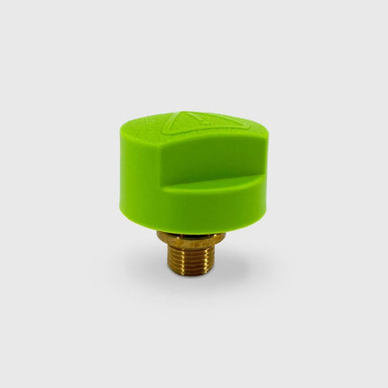 Green valve cap with brass fitting on a white background
