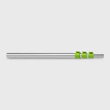 Metallic rod with green clips on a light gray background
