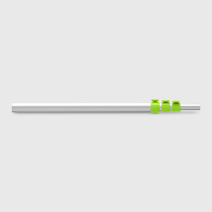 Metallic rod with green bands on a light gray background