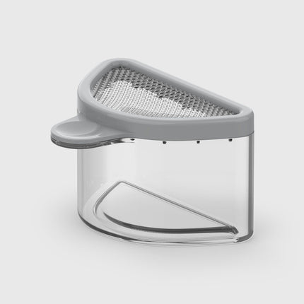 Gray water strainer with clear container on a white background