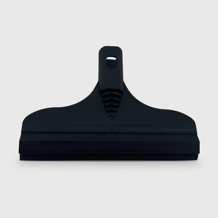 Black squeegee on a light gray background