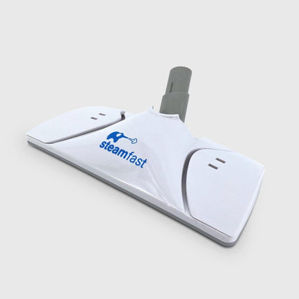 White steam cleaner head with gray handle on a light gray background, featuring the Steamfast logo.