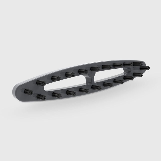 Gray plastic bracket with black bristles on a white background