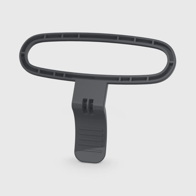 Black plastic tool with a handle on a white background