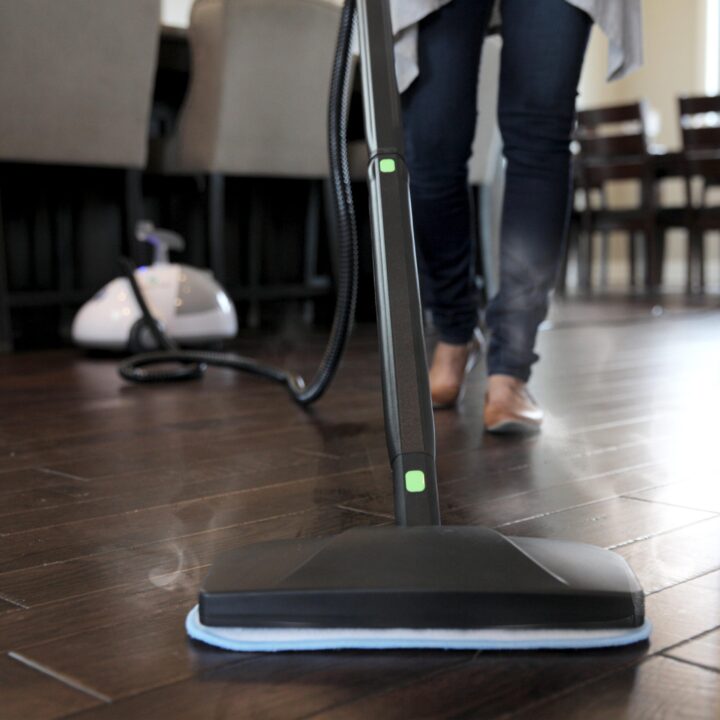 Person cleaning a wood floor with SF-275 Canister Steam Cleaner Mop Attachment