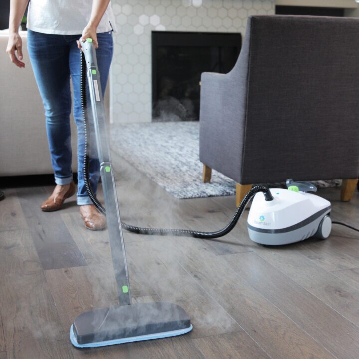 Person using a SF-370 Multipurpose Steam Cleaner to Mop a wood floor