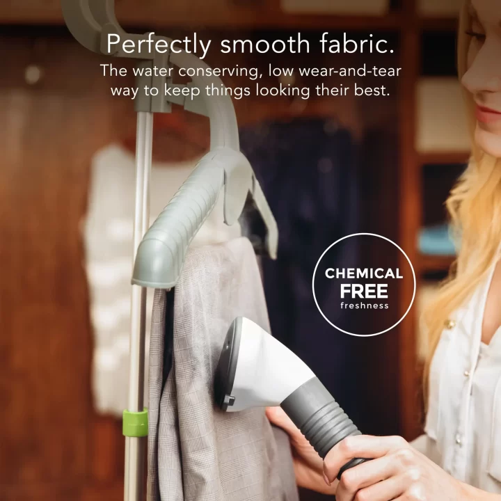 Woman using a SF 520 fabric steamer with supporting text: Perfectly smooth fabric. The water conserving, low wear-and-tear way to keep things looking their best. Chemical free freshness.