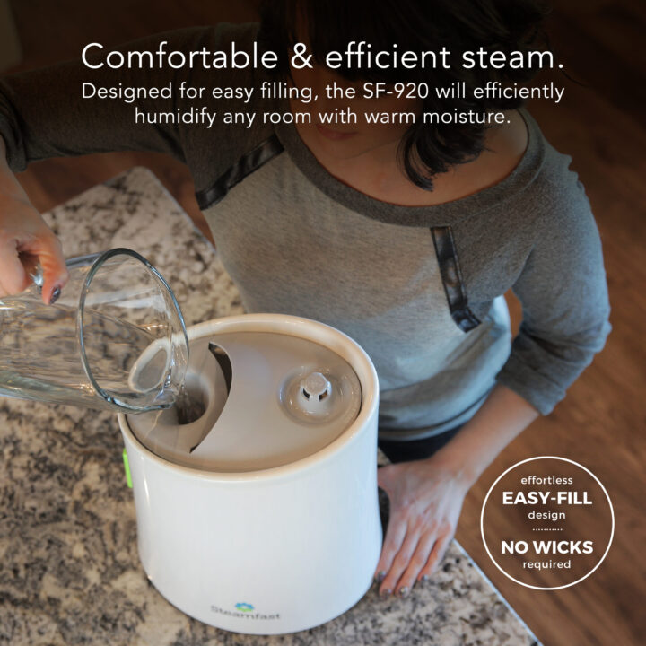 SF-920 Steam Humidifier Filling Tank with the supporting text: Comfortable & efficient steam. Designed for easy filling, the SF-920 will efficiently humidify any room with a warm moisture. Effortless easy-fill design, no wicks required.